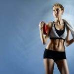Sexy woman wearing sports top and shorts