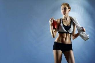 Sexy woman wearing sports top and shorts