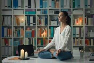 Woman practicing meditation at home